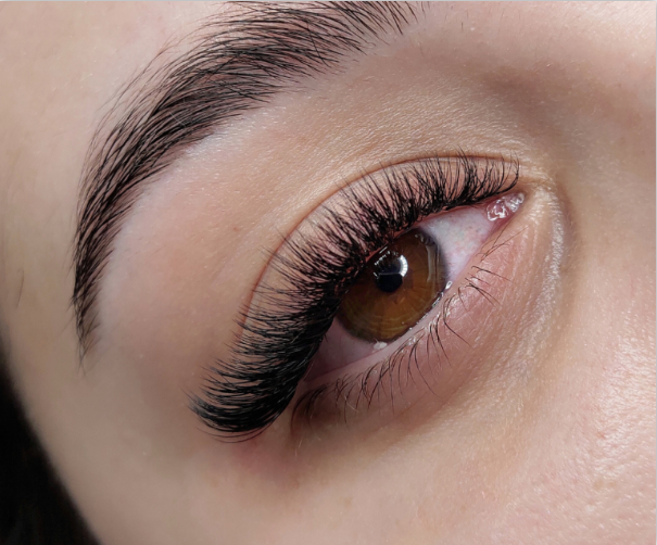 Volume eyelash extensions service in progress