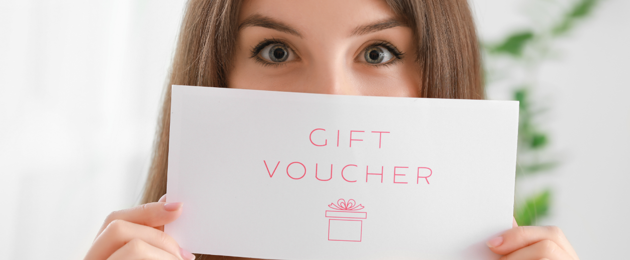 Woman holding a gift voucher card